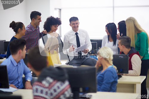 Image of students with teacher  in computer lab classrom