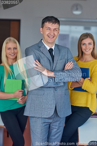 Image of group portrait of teacher with students