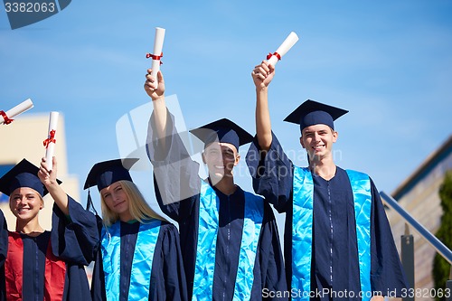 Image of young graduates students group