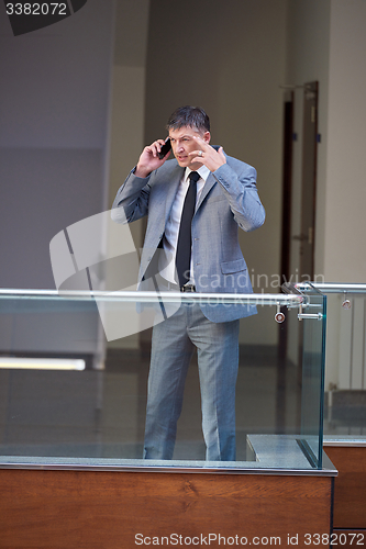 Image of business man using phone