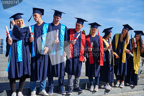 Image of young graduates students group