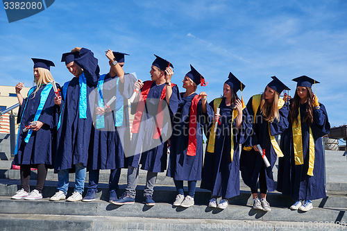 Image of young graduates students group