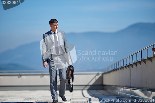 Image of senior  businessman outdoors
