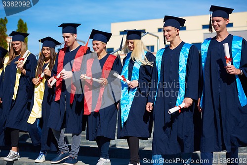 Image of young graduates students group