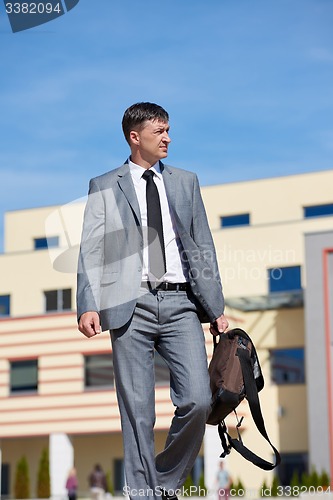 Image of senior  businessman outdoors