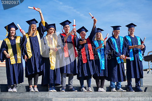 Image of young graduates students group