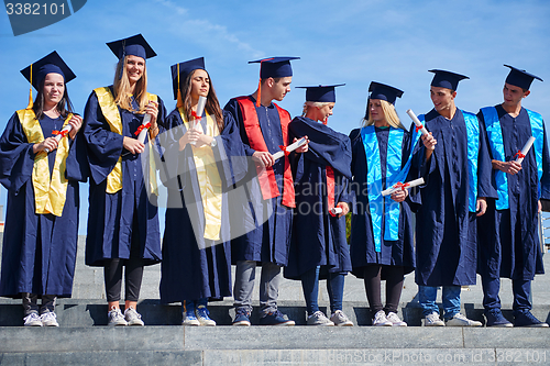 Image of young graduates students group