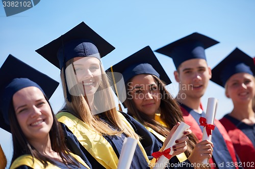 Image of young graduates students group