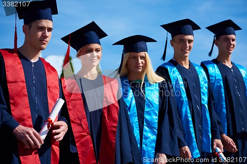 Image of young graduates students group