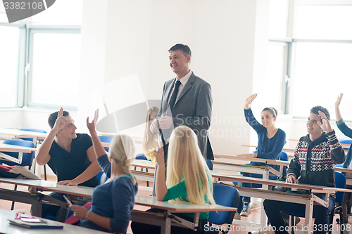 Image of group of students with teacher on class