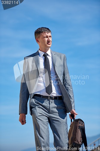 Image of senior  businessman outdoors