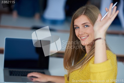 Image of portrait of happy smilling student girl at tech classroom