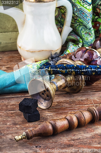 Image of Hookah on  wooden table