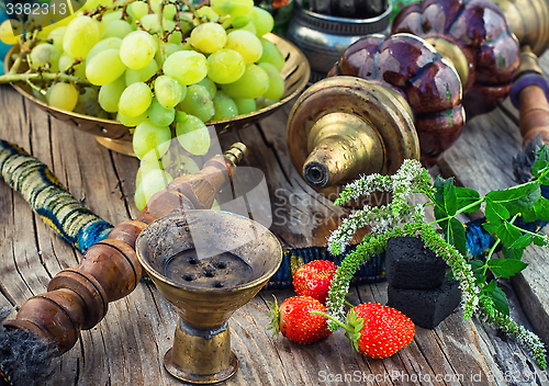 Image of Hookah on  wooden table