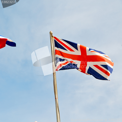 Image of french waving flag in the blue sky british colour and wave