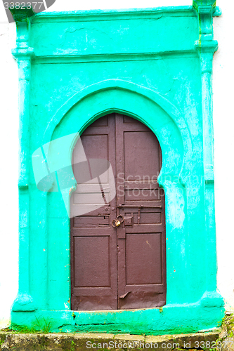 Image of old door in morocco   wall ornate green