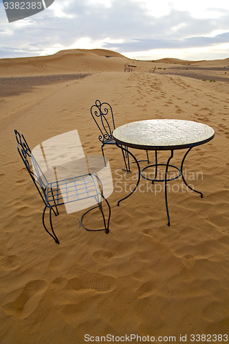 Image of table and seat in   morocco    africa yellow sand