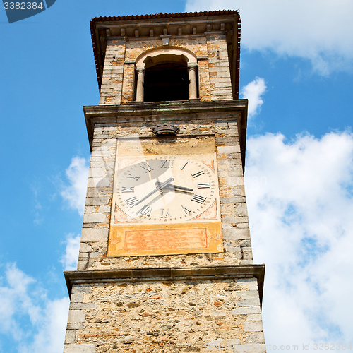 Image of ancien clock tower in italy europe old  stone and bell