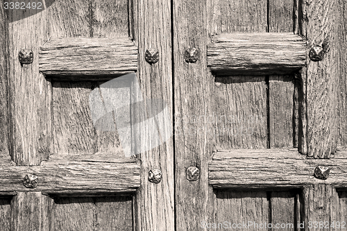 Image of door in italy old ancian wood and trasditional  texture nail