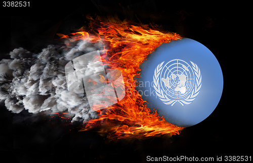 Image of Flag with a trail of fire and smoke - United Nations