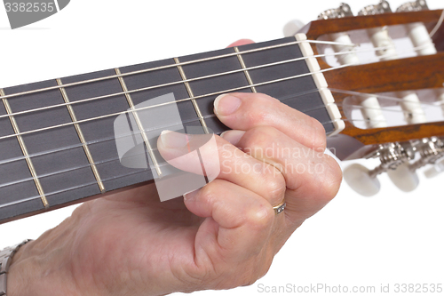 Image of Old hand and guitar isolated