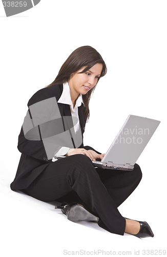 Image of Businesswoman working on a laptop