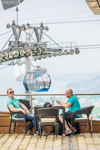 Image of Two friends enjoying together outside