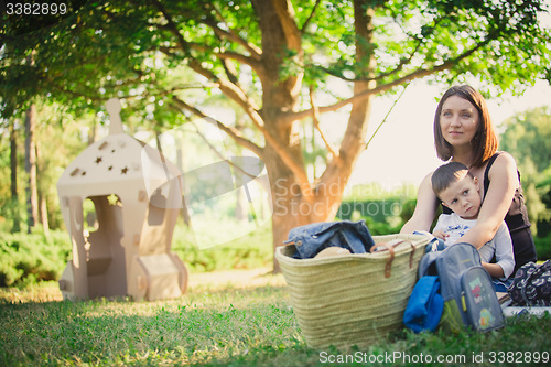 Image of Mother and son in the park summer day.