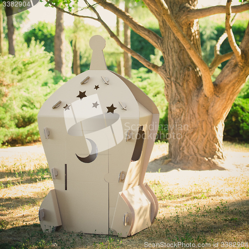 Image of Cardboard toy spaceship in the park