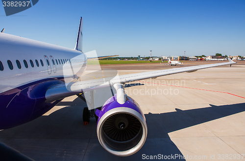 Image of Airplane at terminal gate preparing the takeoff.