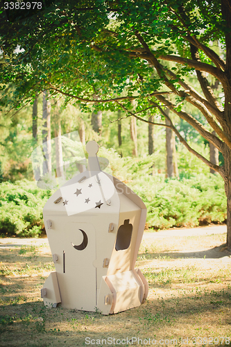 Image of Cardboard toy spaceship in the park