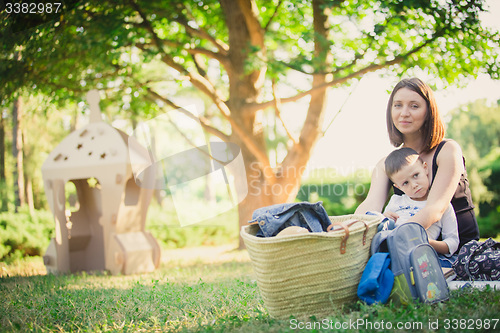 Image of Mother and son in the park summer day.