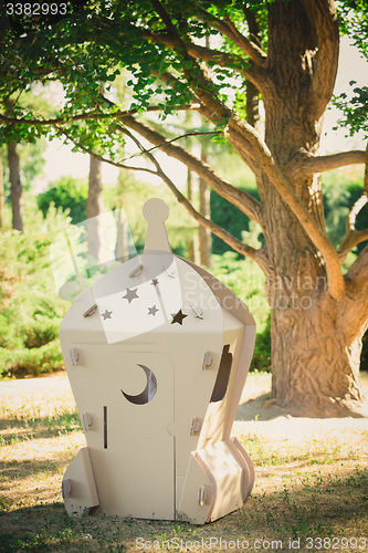 Image of Cardboard toy spaceship in the park