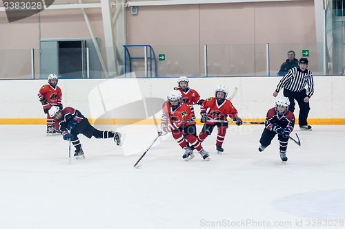 Image of Game moment of children ice-hockey teams