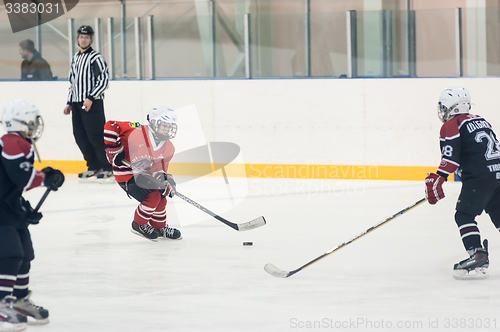 Image of Game of children ice-hockey teams