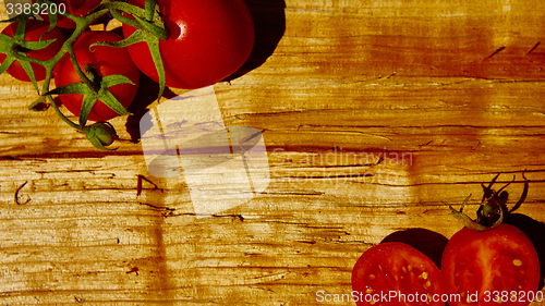 Image of Fresh tomatoes with on wooden table