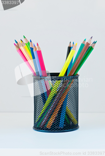 Image of Pencils in a case on the light-coloured shelf