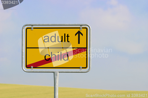 Image of sign child adult
