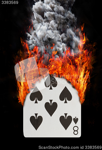 Image of Playing card with fire and smoke