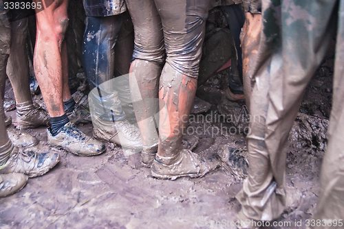 Image of Teams storm wall in extrim race. Feet view