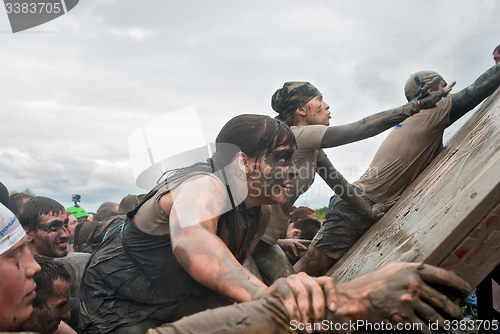 Image of Teams storm wall in extrim race. Steel Character