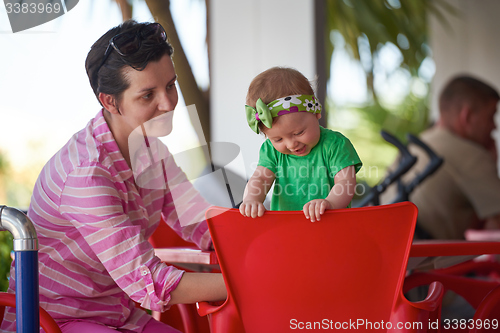 Image of portrait of happy young mother and baby