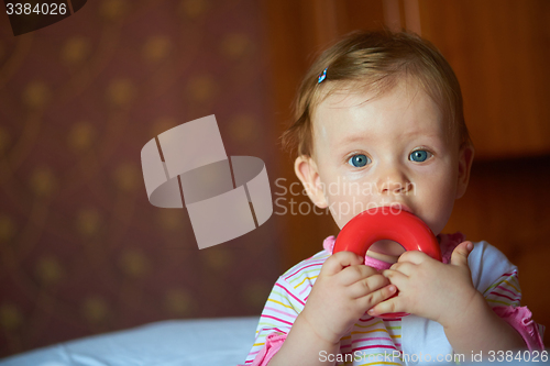 Image of baby playing with toys at home