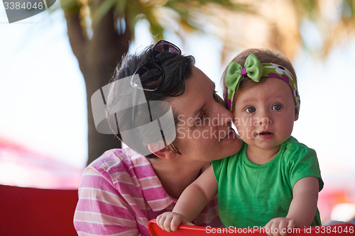 Image of portrait of happy young mother and baby