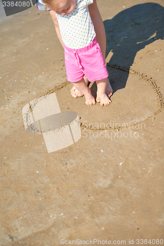 Image of mom and baby on beach  have fun