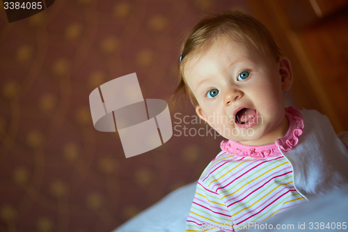 Image of baby playing with toys at home