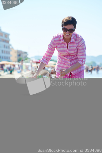 Image of mom and baby on beach  have fun