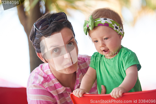 Image of portrait of happy young mother and baby