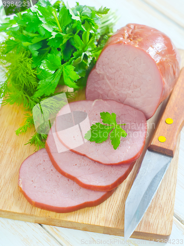 Image of Ham on wooden board