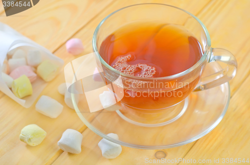 Image of Fresh tea with candy